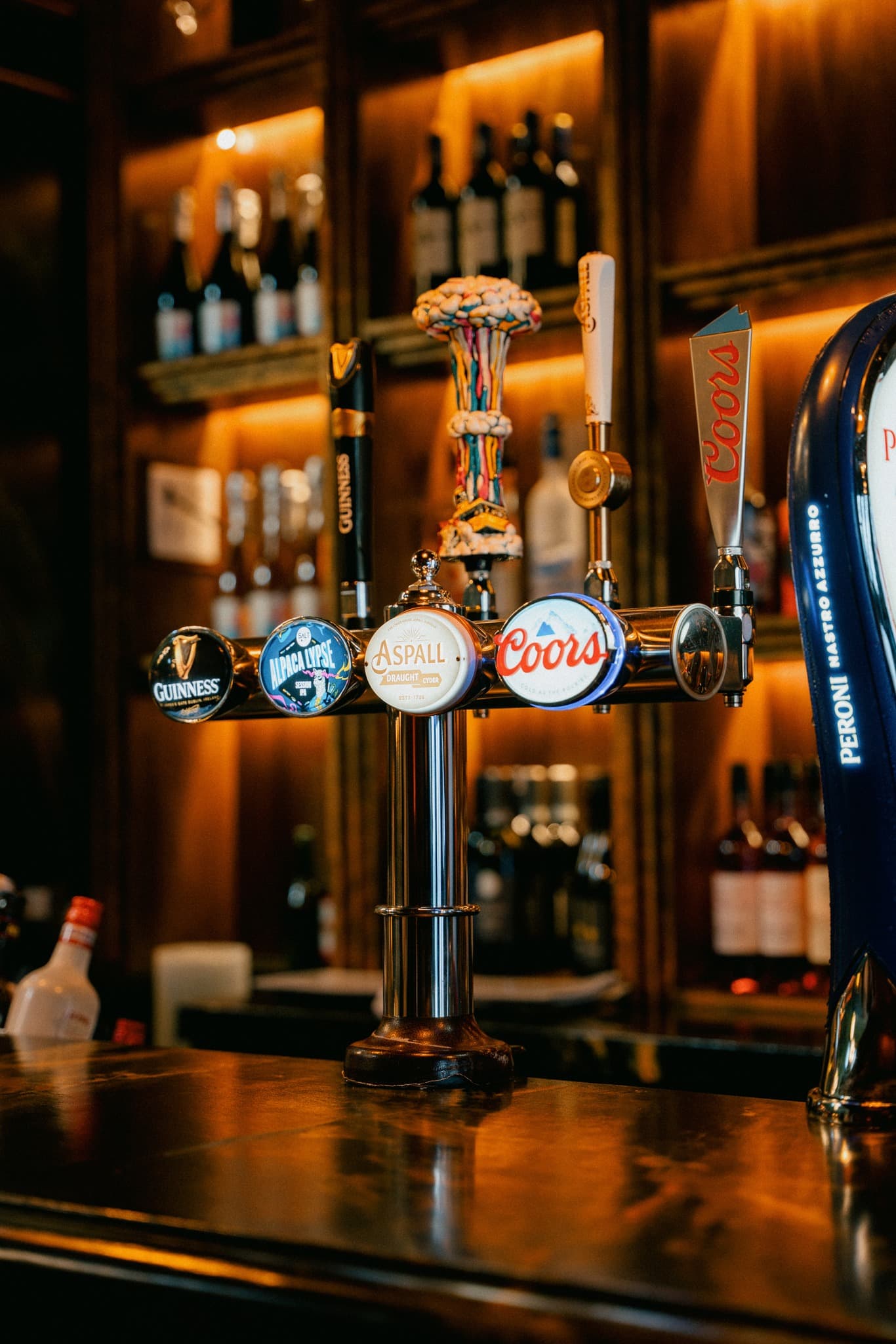 Premium beer taps including Guinness, Aspall, and Coors