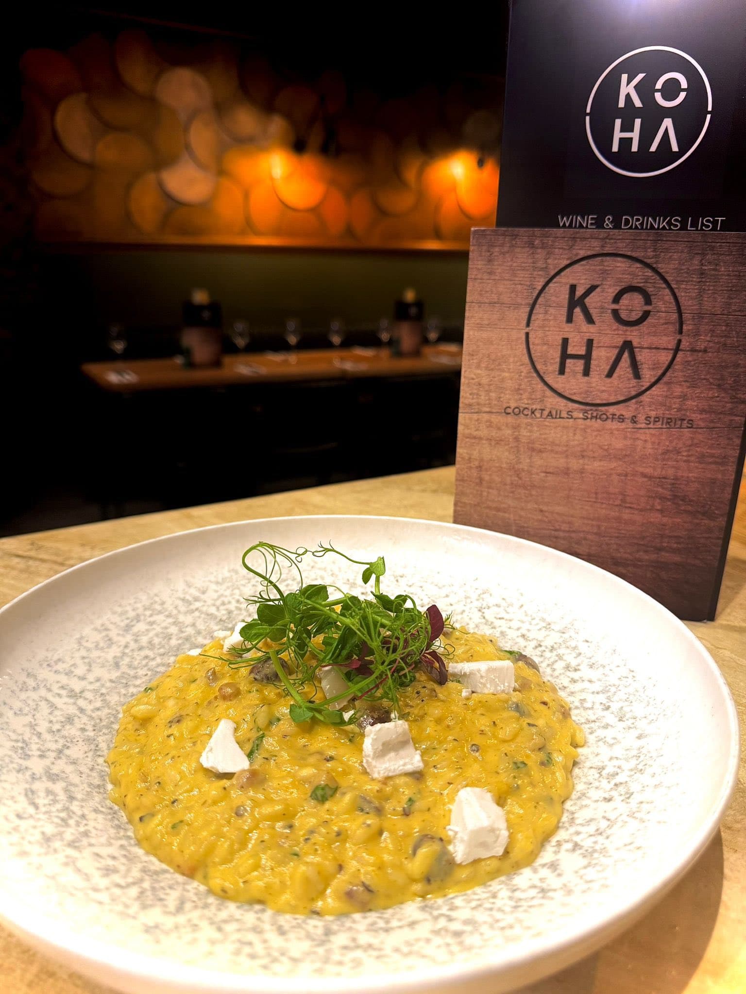 Saffron risotto with goat cheese and microgreens
